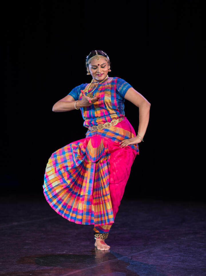 dancer performing in South Asian costume