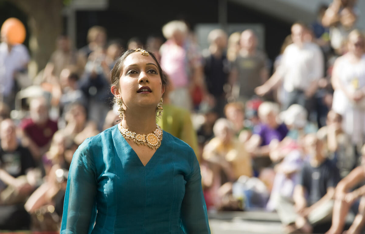 dancer performing outdoors to a crowd