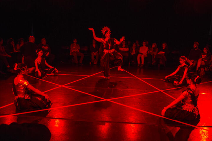 Dancers in a dark space