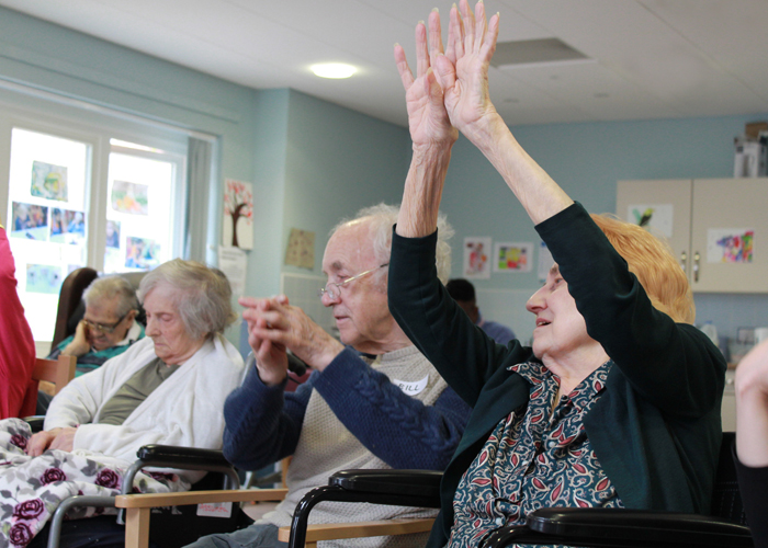 older adults participate in a movement workshop
