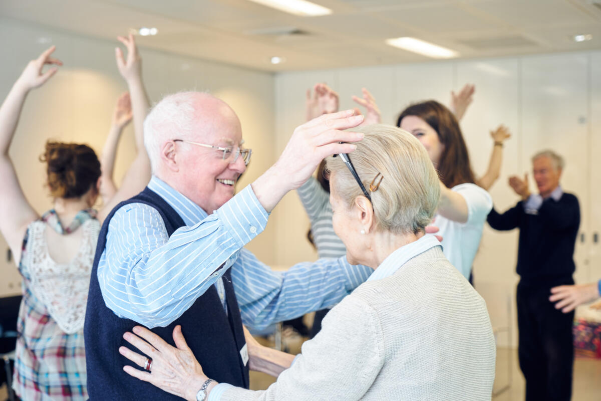 older adults participate in a dance session