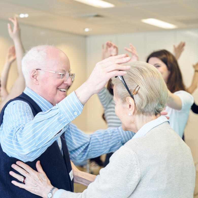 older adults participate in a dance session