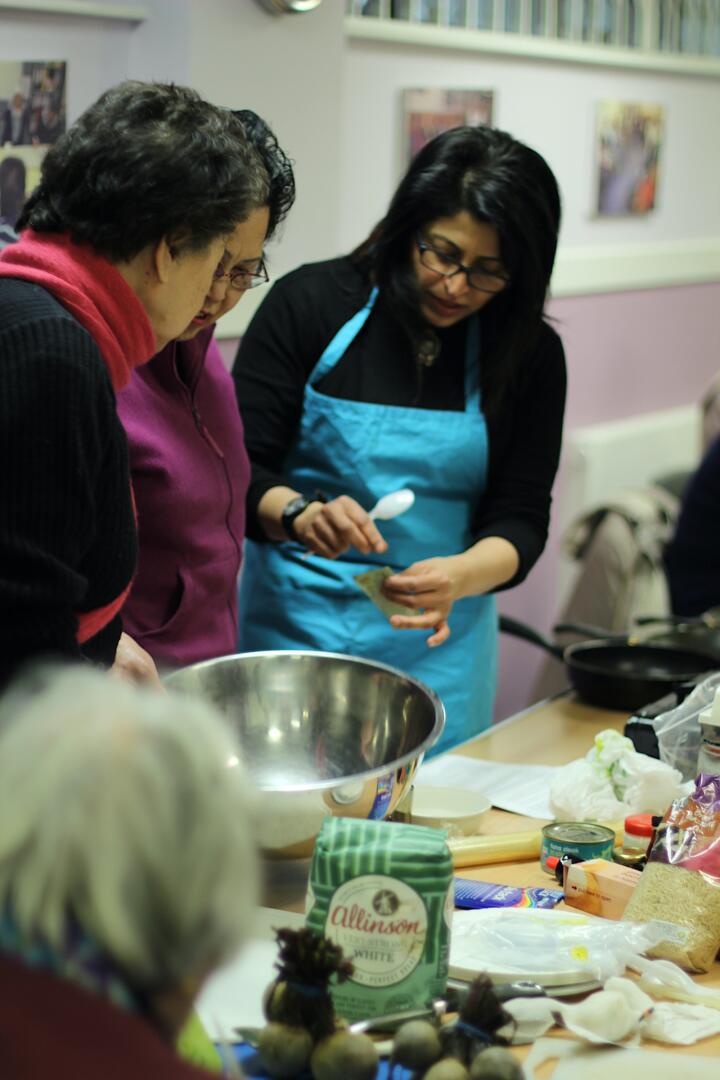 Cooking lesson by Manju Malhi in progress during an Ageing Artfully session