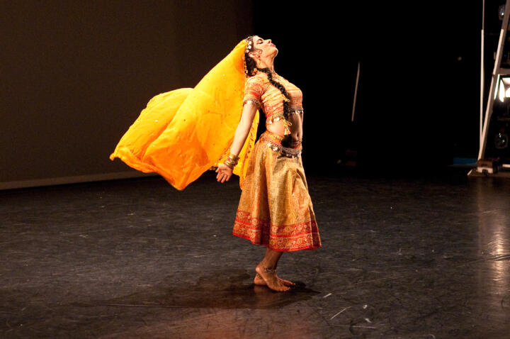 South Asian performer on stage