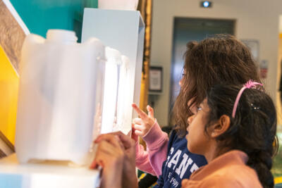 children explore an exhibition display
