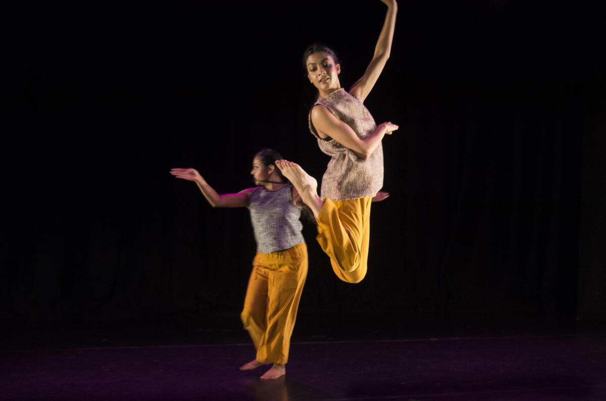 two dancers performing