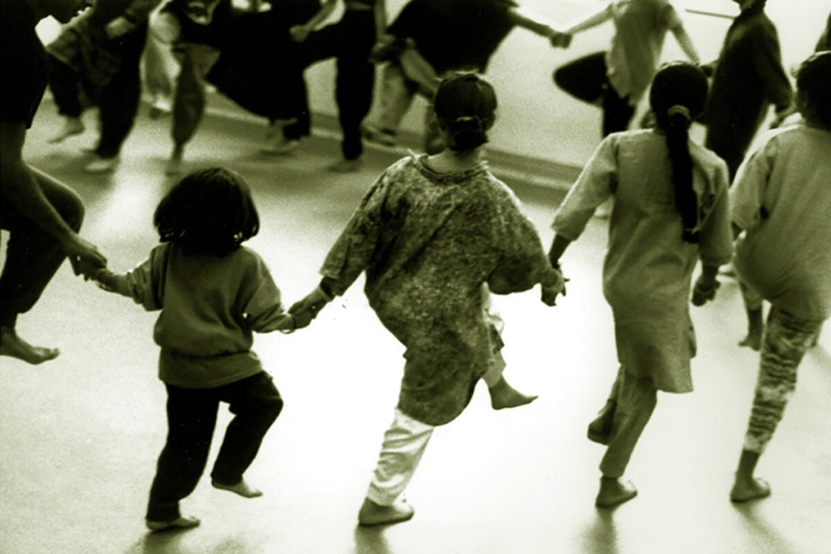 black and white photo of a group of young children dancing