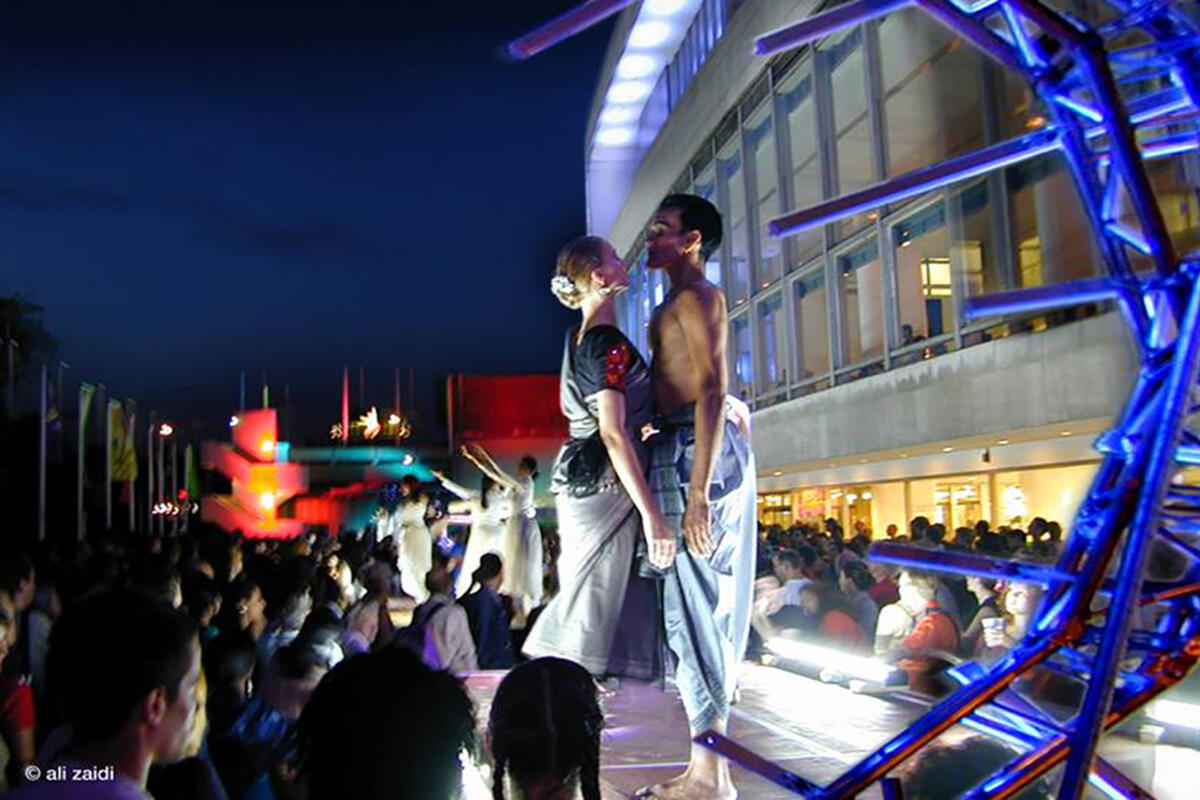 two dancers lit in an outdoor performace
