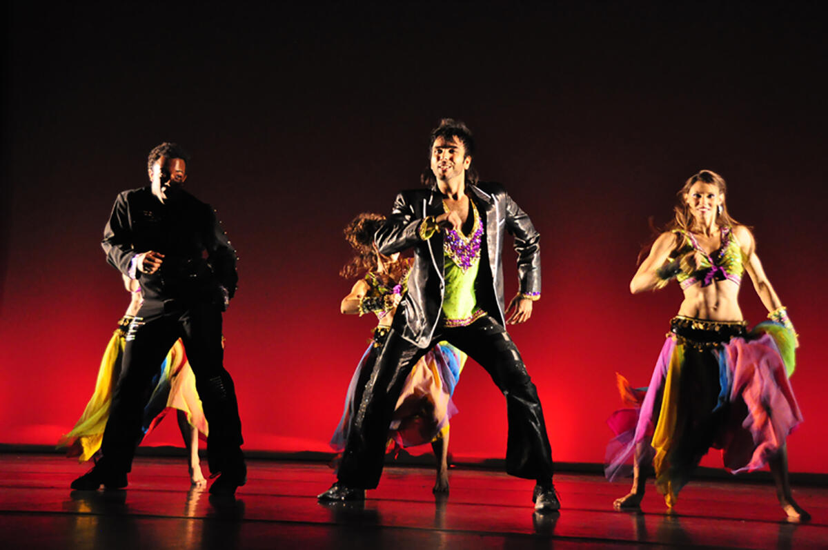 group of dancers performing on stage