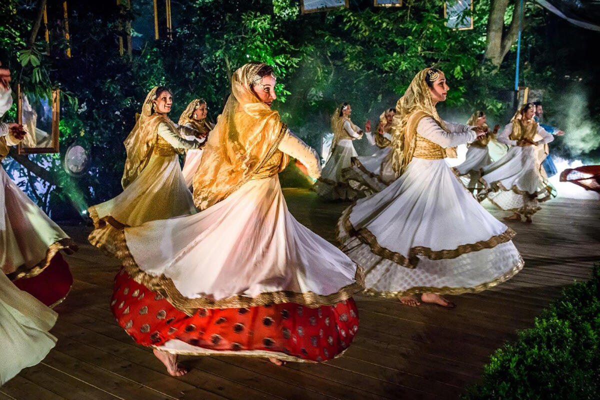 group of dancers perform outdoors