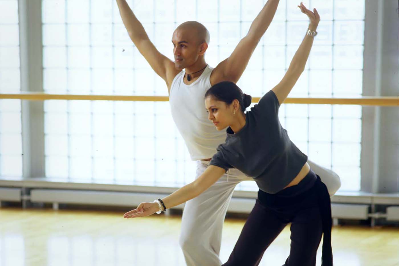 Two dancers in a rehearsal studio